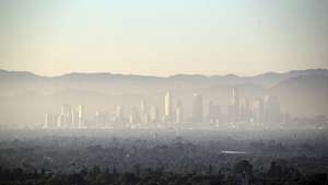 epa07774356 A layer of smog covers Downtown and the nearby areas in Los Angeles, California, 14 August 2019. The Los Angeles-Long Beach metropolitan area has been ranked the worst area in the nation for ozone pollution and also among the worst in terms of particle pollution between 2015 and 2017 according to a recent report from an American Lung Association released earlier this year. The same report states that the average number of unhealthy ozone days also increased between 2018 and 2019.  EPA/ETIENNE LAURENT