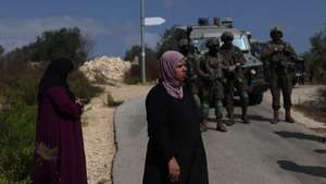 epa13292007 Israeli army and settlers block Palestinian women from reaching their archers to harvest their olive trees, in the West Bank town of Birzeit, 09 October 2026. The olive harvest season in Birzeit which serves as a critical economic pillar and a festive community event has increasingly become a major flashpoint due to tight restrictions and regional violence.  EPA/ATEF SAFADI