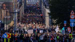 epa13296631 Thousands of people take part in the annual National Climate March, organized by the Climate Coalition, in Brussels, Belgium, 11 October 2026. This year's march calls on leaders to move away from fossil fuels, while participating group Code Red campaigns against nuclear energy, what it describes as 'technofascism,' and data centers.  EPA/OLIVIER MATTHYS