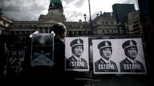 epa13307966 Posters depicting Argentine President Javier Milei with the word 'Scam' are displayed during a protest against his government in Buenos Aires, Argentina, 15 October 2026. Opposition lawmakers failed to secure the quorum needed for the Chamber of Deputies to debate rejecting Milei's emergency decree DNU 70/2023, which introduced sweeping economic deregulation measures.  EPA/JUAN IGNACIO RONCORONI