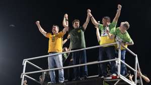 epa13316324 Brazilian presidential candidate Flavio Bolsonaro (L) greets supporters during the 'Bloquinho 22' campaign event in Manaus, Brazil, 19 October 2026. Flavio Bolsonaro faces incumbent Brazilian President Luiz Inacio Lula da Silva in a presidential runoff election on 25 October.  EPA/RAPHAEL ALVES