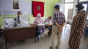 epa09455161 A voter prepares to cast a ballot for the parliamentary elections at a polling station in Sale, Morocco, 08 September 2021. Moroccans were called to vote in parliamentary and local elections.  EPA/JALAL MORCHIDI