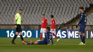 epa09608178 Belenenses's Joao Monteiro reacts after get injured during the Portuguese First League soccer match between Belenenses SAD vs Benfica, at National Stadium, in Oeiras, near of Lisbon, Portugal, 27 November 2021. The match between Belenenses SAD and Benfica ended in the 48th minute, as the Belenenses ran out of the minimum number of players, after starting with only nine, due to an outbreak of covid-19.  EPA/ANTONIO COTRIM