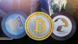 epa09485704 (FILE) - Logos of (L-R) the World Blockchain Marvels, and cryptocurrencies Bitcoin, and CashCowCoin are displayed during the World Blockchain Marvels in Hong Kong, China, 24 August 2018 (reissued 24 September 2021). China's People's Bank on 24 September 2021 in a statement said that "Virtual currency-related business activities are illegal financial activities."  EPA/JEROME FAVRE *** Local Caption *** 54572171