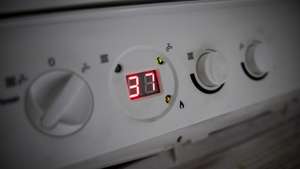 epa10134648 A central heating boiler is set to 37 degrees Celsius at a home in London, Britain, 23 August 2022. Bills regulator Ofgem is set to announce the next energy price cap on 26 August and the rising energy prices is likely to push UK inflation further. Energy bills could hit nearly three times higher than last winter and half of UK households could be facing fuel poverty in the winter according to EDF energy company.  EPA/TOLGA AKMEN