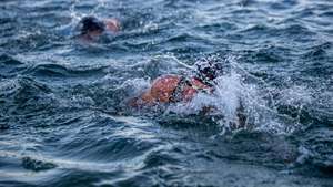epa09414688 Athletes in action during the Swimming Race of the Ironman European Championship 2021 at Forest Lake Langen near Frankfurt am Main, Germany, 15 August 2021.  EPA/Constantin Zinn
