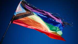 epa10852781 A pride flag waves over the memorial during a commemoration ceremony for the queer victims of the concentration camp Sachsenhausen in Oranienburg near Berlin, Germany, 10 September 2023. In 1942, hundreds of members of the the LGBT community, so-called 'pink triangle' prisoners, of the concentration camp sub-camp 'Klinkerwerk Oranienburg' were murdered in an assassination action. On 10 September 2023, dozens of participants commemorated the victims with speeches, music, and art performances.  EPA/CLEMENS BILAN