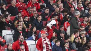 SL Benfica supporter waves a white scarf in protest against the team during the Portuguese First League soccer match between SL Benfica and SC Farense at Luz stadium in Lisbon, Portugal, 08 December 2023. MIGUEL A. LOPES/LUSA