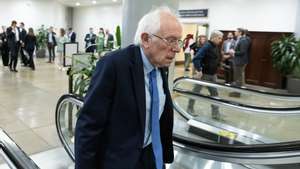 epa11296462 Independent Senator of Vermont Bernie Sanders takes an escalator near the Senate subway during a Senate procedural vote on the national security supplemental, on Capitol Hill in Washington, DC, USA, 23 April 2024. The Senate advanced the national security supplemental with aid to Israel, Ukraine and Taiwan.  EPA/MICHAEL REYNOLDS