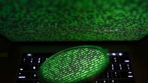 epa06053461 A mirror reflects a computer screen displaying binary code in Taipei, Taiwan, 28 June 2017. Kaspersky Lab reported that the malware, despite resembling 'Petya' malware that affected computers last year, is believed to be a new type of ransomware, which the cybersecurity company called 'ExPetr'. The ransomware has reportedly affected mostly Ukraine and Russia and several cases were also found in Poland, Italy, Britain, Germany, France, the US and several other countries, with around 2,000 cases reported so far. The ransomware has reportedly affected US pharmaceutical giant Merck, Russia's oil producer Rosneft, Ukrainian central bank, Spanish food company Mondelez, Australia's Cadbury chocolate factory and French shipping company TNT, among other global companies.  EPA/RITCHIE B. TONGO