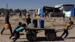 epa11455944 Children move a cart with containers as displaced Palestinians collect drinking water from a water tanker at a makeshift camp in the Khan Yunis refugee camp in the southern Gaza Strip, 03 July 2024. Since 07 October 2023, up to 1.7 million people, or more than 75 percent of the population, have been displaced throughout the Gaza Strip, some more than once, in search of safety, according to the United Nations Relief and Works Agency for Palestine Refugees in the Near East (UNRWA), which added that the Palestinian enclave is &#039;on the brink of famine&#039;, with 1.1 million people (half of its population) &#039;experiencing catastrophic food insecurity&#039; due to the conflict and restrictions on humanitarian access.  EPA/HAITHAM IMAD