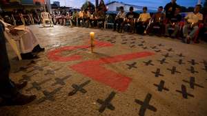 epa07783387 Central American migrants pray during the anniversary of the 2011 San Fernando massacre, at the Migrant House in Saltillo, Mexico, 20 August 2019. A total of 72 people were allegedly killed during the 2011 massacre by &#039;Los Zetas&#039; cartel with the complicity of the local police on 22 August 2010.  EPA/MIGUEL SIERRA