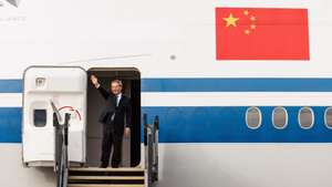 epa11419255 Chinese Premier Li Qiang waves as he boards an airplane departing from Perth Airport in Perth, Australia, 18 June 2024. China&#039;s Premier Qiang was on a four-day visit to Australia.  EPA/RICHARD WAINWRIGHT AUSTRALIA AND NEW ZEALAND OUT