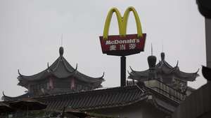 epa05706503 (FILE) - A file photo dated 09 March 2016 shows the signage of a McDonald's restaurant in the Dongmen pedestrian area in Shenzhen, Guangdong Province, China. According to reports on 09 January 2017, US hamburger and fast food restaurant chain McDonald's is planning to sign an agreement to sell 80 percent of its mainland China and Hong Kong franchise business to a consortium of Citic Group Corp., and to Carlyle Group LP. The deal is valued at two billion US dollar including debt, media added. McDonald's is said to retain a 20 percent shareholding in the venture.  EPA/FREDDY CHAN