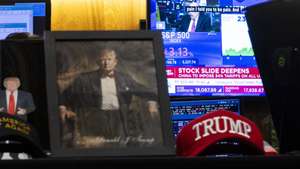 epaselect epa12009702 Pictures of US President Donald Trump on the floor of the New York Stock Exchange in New York, New York, USA, on 04 April 2025. World financial markets are continuing to react to reciprocal tariffs that US President Donald Trump implemented this week.  EPA/JUSTIN LANE