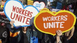 epa12068602 People march in a May Day rally in New York, New York, USA, 01 May 2025. International Workers' Day, also known as Labor Day or May Day, is observed worldwide on 01 May to celebrate the economic and social achievements of workers as well as fight for laborers' rights.  EPA/SARAH YENESEL