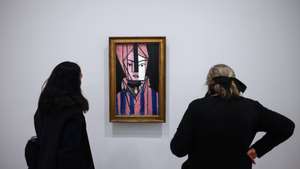 epa12007276 Women look at a painting entitled ‘White and Pink Head’ by French painter Henri Matisse on display during the exhibition ‘Matisse and Marguerite, Through Her Father's Eyes’ at the Museum of Modern Art in Paris, France, 03 April 2025. The exhibition runs from 04 April to 24 August 2025.  EPA/YOAN VALAT