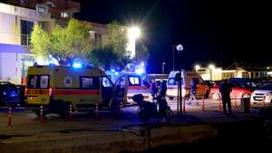 epa12703624 Ambulances transport injured people at a port in Chios Island, Greece, 03 February 2026. At least 14 people were killed after a collision between a speedboat carrying migrants and a Greek Coast Guard vessel in the Myrsinidio maritime area off ​​Chios Island, and around 25 people were transported to Chios Hospital, according to the Greek Coast Guard.  EPA/KOSTAS KOURGIAS