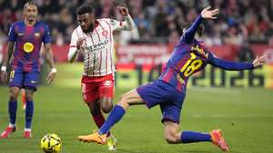 epa12748328 FC Barcelona's Gerard Marti (R) in action against Girona's Thomas Lemar (C) during the Spanish LaLiga soccer match between Girona FC and FC Barcelona, in Girona, Spain, 16 February 2026.  EPA/David Borrat