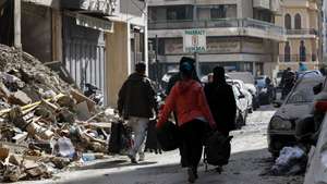 epaselect epa12829176 People evacuate their homes, carrying their belongings, after an Israeli strike hit an apartment in a building in the Zuqaq al-Blat district of central Beirut, Lebanon, 18 March 2026. According to the Lebanese Ministry of Public Health, more than 912 people were killed and 2,221 others injured in airstrikes across Beirut's southern suburbs and villages in southern Lebanon since the start of renewed hostilities. The Israeli military stated that it is conducting strikes across the country targeting Hezbollah infrastructure and personnel.  EPA/WAEL HAMZEH