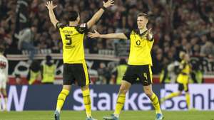 epa12869510 Ramy Bensebaini of Dortmund (L) and Nico Schlotterbeck of Dortmund (R) celebrate after Julian Brandt of Dortmund  scored 0-2 during the German Bundesliga soccer match between VfB Stuttgart and Borussia Dortmund in Stuttgart, Germany, 04 April 2026.  EPA/CHRISTOPHER NEUNDORF CONDITIONS - ATTENTION: The DFL regulations prohibit any use of photographs as image sequences and/or quasi-video.