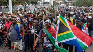 epa13075199 Members of the Zulu community take part in a rally against undocumented immigrants during a nationwide anti-immigrant movement shutdown in Durban, South Africa, 30 June 2026. Marches are planned across South Africa as a large number of organizations under the umbrella of the 'March and March movement' take to the streets of major cities to protest against the high number of legal and illegal immigrants living in the country. Although the protesters issued an ultimatum demanding that foreign nationals leave South Africa by 30 June, the South African government has explicitly rejected the shutdown and declared June 30 a normal working day.  EPA/STRINGER