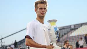 epa13134725 Luca Van Assche of France celebrates with the trophy after winning the final against Alexander Blockx of Belgium during their final match of the Estoril Open Tennis tournament in Estoril, outskirts of Lisbon, Portugal, 26 July 2026.  EPA/JOSE SENA GOULAO