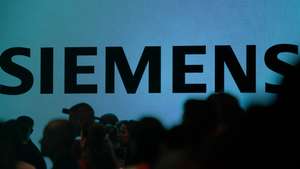 epa12354228 The Siemens logo is seen on a display during the opening day of the IFA trade fair in Berlin, Germany, 05 September 2025. The IFA, the world's largest trade show for consumer electronics and home appliances runs from 05 to 09 September 2025.  EPA/CLEMENS BILAN
