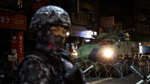 epa13164627 Taiwan Military armored vehicle maneuvers during a drill as part of the annual Han Kuang military exercises in Taipei, Taiwan, 13 August 2026. Taiwan’s Han Kuang exercises test combat readiness against a potential Chinese invasion.  EPA/RITCHIE B. TONGO