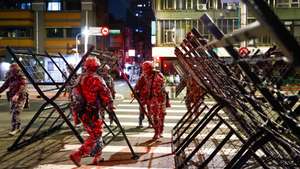 epa13164219 Taiwanese Military Police personnel install road blockades during a drill as part of the annual Han Kuang military exercises in Taipei, Taiwan, 12 August 2026. Taiwan’s Han Kuang exercises test combat readiness against a potential Chinese invasion.  EPA/RITCHIE B. TONGO
