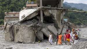 epa13218955 Hindu priest performs a 13th-day ritual in an area damaged by flash floods in Dhunge, Nuwakot district, Nepal, 07 September 2026. Nepal is observing a national day of mourning on the 13th day following devastating flash floods. More than 1,200 people have been killed, and over 4,000 remain missing across northern Nepal after a glacial collapse and avalanche-triggered flash floods and mudslides along the Bhotekoshi and Trishuli river valleys near the Nepal-Tibet border, causing widespread destruction to settlements and infrastructure, according to the National Disaster Risk Reduction and Management Authority (NDRRMA).  EPA/NARENDRA SHRESTHA
