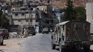 epa13211153 Israeli soldiers patrol during the release of Palestinian prisoners during an army operation in Askar refugee camp near the west bank city of Nablus,  04 September 2026. Israeli troops started an operation at Askar refugee camp near Nablus City early on 04 September.  EPA/ALAA BADARNEH