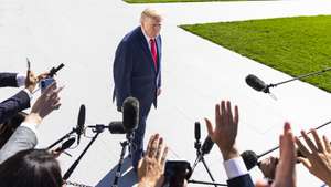 epa13300719 US President Donald Trump (C) speaks to reporters as he departs the White House for Alaska, in Washington, DC, USA, 13 October 2026. President Trump is traveling to Alaska to campaign for incumbent Republican Senator Dan S. Sullivan, who is running for re-election in November 2026.  EPA/JIM LO SCALZO
