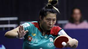 epa10129402 Jieni Shao of Portugal competes against Xiaona Shan of Germany during their table tennis Women’s Singles quarterfinal at the European Championships Munich 2022, in Munich, Germany, 19 August 2022.  EPA/RONALD WITTEK