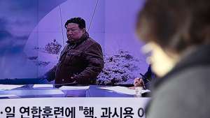 epa11111826 A woman watches a news segment pertaining to a recent North Korean missile launch, at a station in Seoul, South Korea, 29 January 2024. According to the official North Korean Central New Agency (KCNA), the test-fire of the new submarine-launched strategic cruise missile was launched to demonstrate the rapid development and strengthening of the 'nuclear weaponization' of the naval force.  EPA/JEON HEON-KYUN