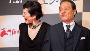 epa03791365 Japanese cast members Kaori Momoi (L) and Toshiyuki Nishida (R) pose for photographers during a press conference for the film &#039;Emperor&#039; in Tokyo, Japan, 18 July 2013. The post-World War II film will hit Japanese movie theaters on 27 July.  EPA/CHRISTOPHER JUE