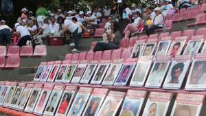 epa13200941 Photographs of missing persons are displayed on the boardwalk to mark the International Day of the Victims of Enforced Disappearances in Cucuta, Colombia 30 August 2026. The International Day of the Victims of Enforced Disappearances is observed annually on 30 August to raise awareness of enforced disappearances and honour victims and their families.  EPA/MARIO CAICEDO
