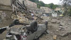 epa10763598 A man takes smartphone photos while standing within rubble and destruction caused to residential buildings by Russian shelling in Odesa, southern Ukraine, 23 July 2023. Odesa was attacked by 19 missiles of different classes early 23 July, with nine being shot down, according to a statement from the Ukraine Air Force. At least one person was killed in the attack and 22 were injured, including four children, the State Emergency Service reported. Russia, which began its full-scale invasion of Ukraine in February 2022, has recently pulled out of a UN-Turkey brokered agreement guaranteeing safe passage to Ukrainian grain exports through the Black Sea and started the mass shelling of Odesa city, granaries, agricultural enterprises and sea ports.  EPA/IGOR TKACHENKO