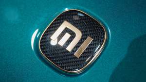 epa12054104 A Xiaomi logo on a car on display at the booth of Chinese technology company Xiaomi during the first public day of the Shanghai Auto show, in Shanghai, China, 25 April 2025. The 21st Shanghai International Automobile Industry Exhibition will be held from 23 April to 02 May. Shanghai Auto will feature over 70 automakers and 100 new models.  EPA/ALEX PLAVEVSKI
