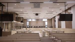 epa09442661 An interior view of the temporary courtroom prepared for trial over 2015 terrorist attacks at the courthouse in Paris, France, 02 September 2021. The trial over the 13 November 2015 terrorist attacks is due to start on 08 September 2021 and will last nine months. The attacks killed 130 people with hundreds injured which targeted the Bataclan concert hall, the Stade de France national sports stadium, and several restaurants and bars.  EPA/YOAN VALAT