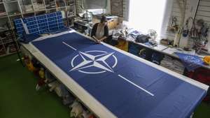epaselect epa11204068 Seamstress Tove Lycke at work with new NATO flags, at the flag manufacturer 'Flagghuset', in Akersberga, outside Stockholm, Sweden, 07 March 2024. At the family business in Akersberga, printing the blue NATO flag is in full swing ahead of Sweden's accession to NATO, as municipalities, authorities and businesses want to be ready to raise the new flag. Hungary’s president ratified Stockholm’s accession documents on 05 March, paving the way for the accession of the Nordic country to the alliance.  EPA/Anders Wiklund SWEDEN OUT