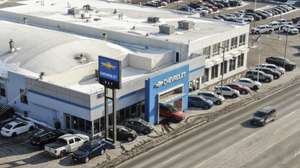 epa09720381 An aerial photo made with a drone shows a Chevrolet dealership in Fox Lake, Illinois, USA, 31 January 2022. General Motors, the maker of Chevrolet, Buick, GMC, and Cadillac in the US, is set to release its fourth quarter 2021 earnings on 01 February 2022. Analysts predict the largest auto maker in the world to show earnings of 1.15 US dollars per share.  EPA/TANNEN MAURY