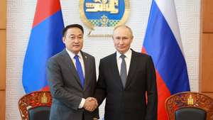 epa11582128 Russian President Vladimir Putin (R) and Mongolian Chairman of the State Great Khural of Mongolia, Dashzegve Amarbayasgalan shake hands during their meeting in Ulaanbaatar, Mongolia 03 September 2024. Putin visits Mongolia in his first trip to a member state of the International Criminal Court (ICC) since the court issued an arrest warrant for him last year.  EPA/BYAMBASUREN BYAMBA-OCHIR