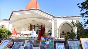 epa07160175 Pictures of massacre victims are displayed during a commemoration ceremony for the Santa Cruz massacre in Dili, East Timor, also known as Timor Leste, 12 November 2018. Thousands of East Timorese commemorated the at least 250 pro-independence demonstrators who were killed at the Santa Cruz graveyard 27 years ago on 12 November 1991.  EPA/ANTONIO DASIPARU