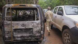 epa04880198 A soldier from Mali surveys the scene of a terrorist attack at hotel Byblos in Sevare, Mali, 11 August 2015. Twelve people comprising of five terrorists, five Mali soldiers and two foreigners were killed in a hostage siege at the hotel Byblos on 07 August 2015. Terrorists seiged the Byblos resulting in Mali government troops having to storm the hotel. One of the foreign victims was reported to be a member of the UN peacekeeping mission (MINUSMA) and one was from South Africa. This attack is the third assault in a week. Mali is still trying to restore stability following the advance of Al-qaeda linked fighters which led to a war in 2013. A peace deal agreed to in June 2015 was hoped to end years of unrest and ethnic divisions.  EPA/STR