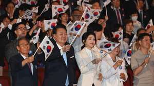 epa11549370 South Korean President Yoon Suk-Yeol (C-L) and his wife Kim Keon-Hee (C-R) wave national flags during the celebration of the 79th National Liberation Day at Sejong Center of the Performing Arts in Seoul, South Korea, 15 August 2024. The National Liberation Day marks South Korea&#039;s independence from Japanese colonial rule following the end of World War II, after Japan surrendered between 14 and 15 August in 1945.  EPA/Kim Min-Hee / POOL