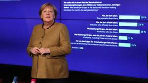 epa09563351 German Chancellor Angela Merkel during her visit at the German Emigration Center (Deutsches Auswandererhaus) in Bremerhaven, northern Germany, 04 November 2021. The visit is part of Merkel's farewell tour to the German federal states.  EPA/FOCKE STRANGMANN / POOL