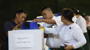 epa12679834 Myanmar electoral officials uninstall an electronic voting machine (EVM) after closing the third phase of the general election at a polling station in Yangon, Myanmar, 25 January 2026. Myanmar's military government, known as the State Administration Council (SAC), plans to hold its first national vote since the February 2021 coup through a multi-stage general election, with the first phase scheduled for 28 December 2025, followed by the second phase on 11 January 2026, and the third phase on 25 January 2026.  EPA/RUNGROJ YONGRIT