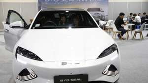 epa11679324 Visitors inspect an BYD Seal electric car at the Bangkok EV Expo 2024 in Bangkok, Thailand, 24 October 2024. The Bangkok EV Expo 2024 is an event showcasing various brands of electric vehicles and alternative energy such as Solar Cell and Solar Rooftop. More than 80,000 new EV cars were registered in the country this year, according to the Electric Vehicle Association of Thailand.  EPA/RUNGROJ YONGRIT
