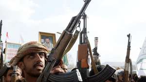 epa13103391 Houthi supporters hold up their weapons during a protest in solidarity with the Iranian people, and against US airstrikes on Iran, in Sana'a, Yemen, 10 July 2026. The US military resumed strikes against Iranian targets on 08 July, shattering the interim ceasefire between the two nations.  EPA/YAHYA ARHAB